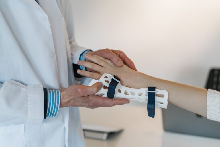 Podiatrist holding a custom orthotic insole at ModPod Podiatry Sydney clinic