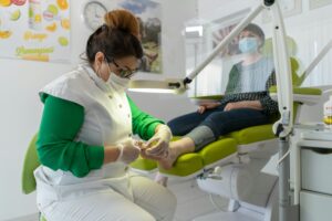 Podiatrist performing medical pedicure foot care treatment at ModPod Sydney clinic