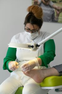 podiatrist treating patient toenail fungus at Sydney clinic